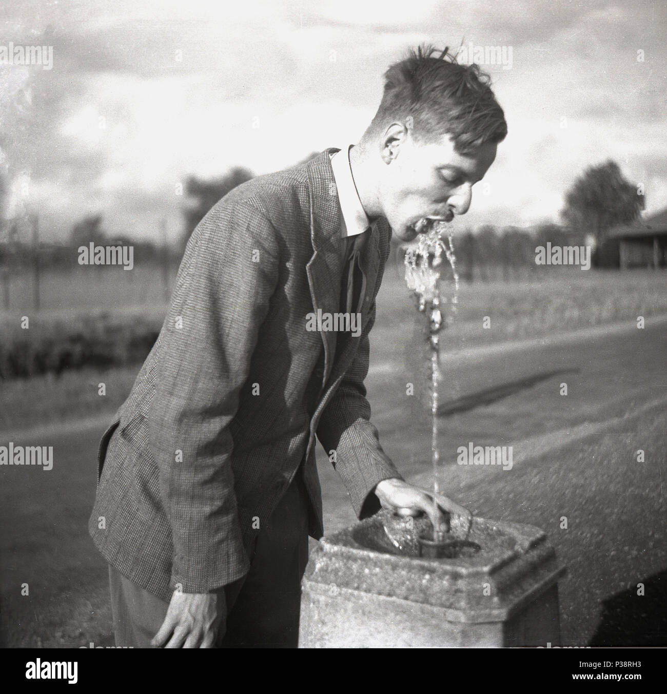 Black man water fountain hires stock photography and images Alamy