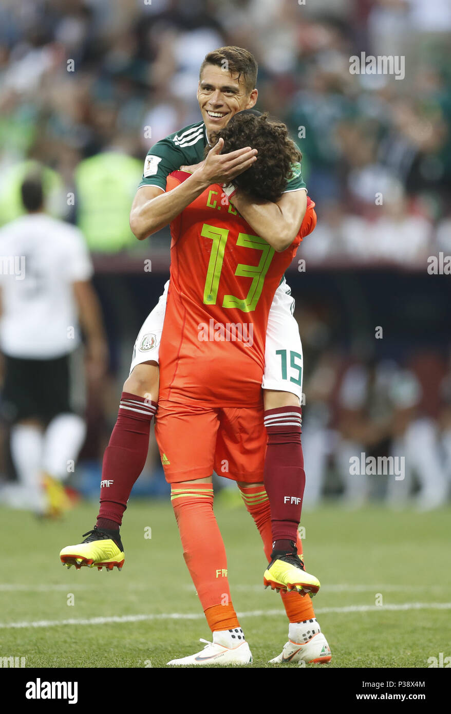 Moscow, Russia. 17th June, 2018. Hector Moreno (top) of Mexico celebrates victory with teammate Guillermo Ochoa after a group F match between Germany and Mexico at the 2018 FIFA World Cup in Moscow, Russia, June 17, 2018. Mexico won 1-0. Credit: Cao Can/Xinhua/Alamy Live News Stock Photo