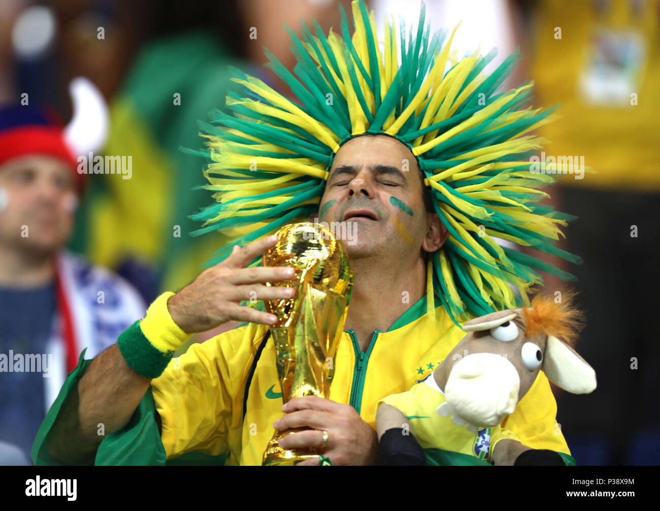 Rostov, Russia, 17th June, 2018. A fan of Brazil holds a replica of the World Cup trophy prior to a group E match between Brazil and Switzerland at the 2018 FIFA World Cup in Rostov-on-Don, Russia, June 17, 2018. Credit: Lu Jinbo/Xinhua/Alamy Live News Stock Photo