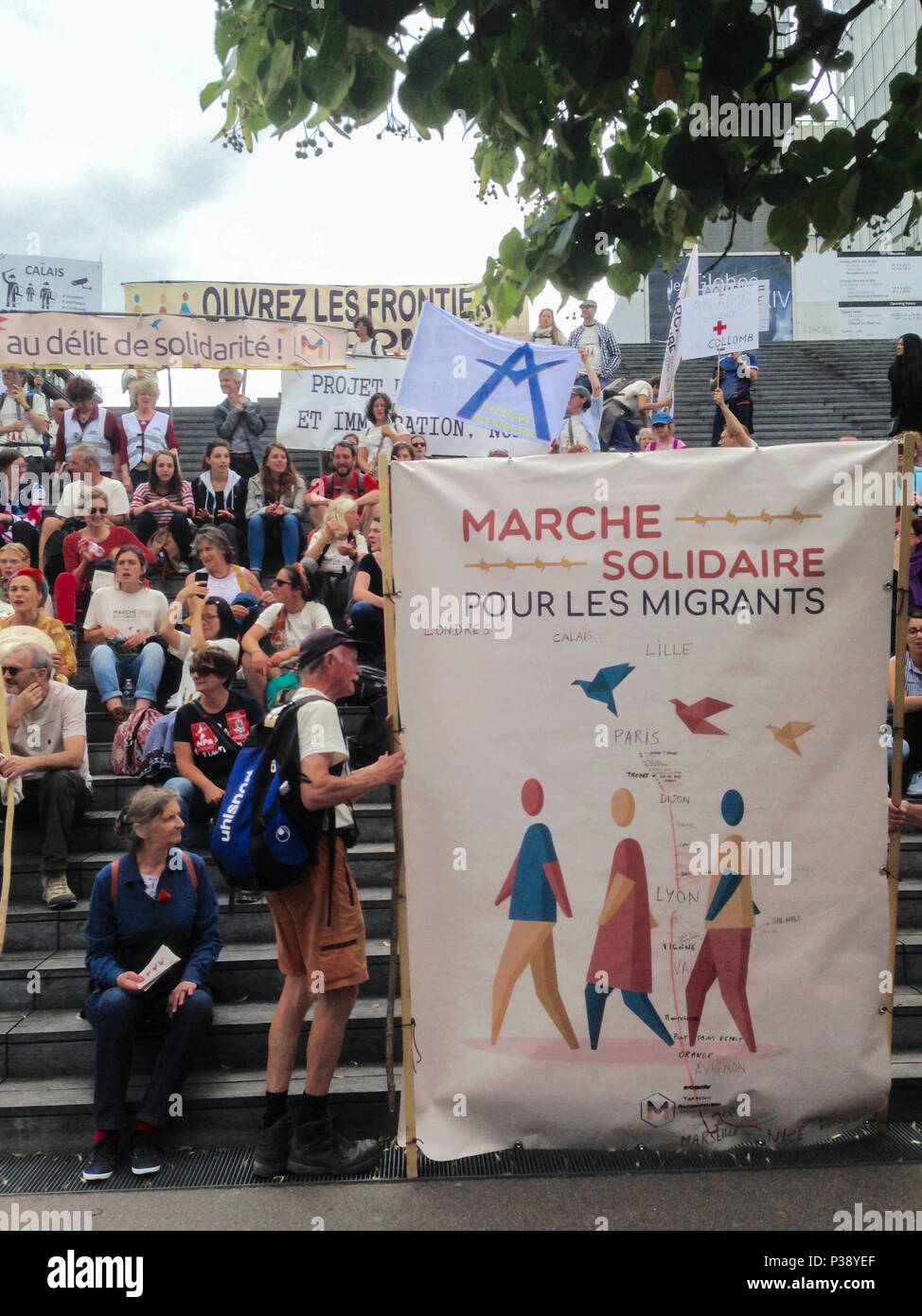 Paris, France. Large Crowd of People, Solidarity March for Migrants, Against Anti-Immigration Laws, French Protest Poster, France Protests, immigration protests Stock Photo