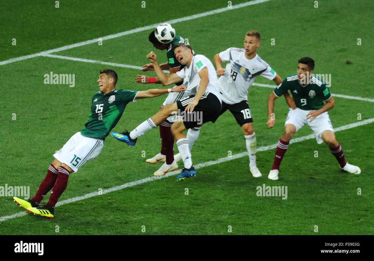 17 June 2018, Russia, Moscow, Soccer, FIFA World Cup, Group F, Matchday 1 of 3, Germany vs Mexico at the Luzhniki Stadium: Germany's Thomas Mueller and Joshua Kimmich (2-R) in action against Mexico's Hector Moreno and Raúl Jimenez. Photo: Christian Charisius/dpa Stock Photo