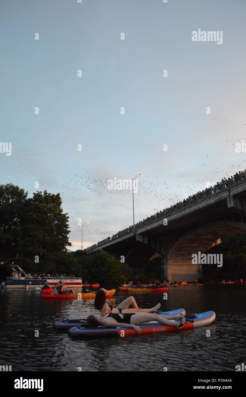 Austin, Texas, USA. 17th June, 2018. People go batty for one of Austin's local attractions. Sunday evening at sunset, millions of Mexico free-tailed bats leave their perch under the Congress Avenue Bridge over Lady Bird Lake in downtown Austin, Texas to feed on insects. Thousands of onlookers line the bridge to watch the spectacle which happens nightly from about March to November. The flight pattern can be up to 2-mile high. Credit: Glenn Ruthven/Alamy Live News Stock Photo