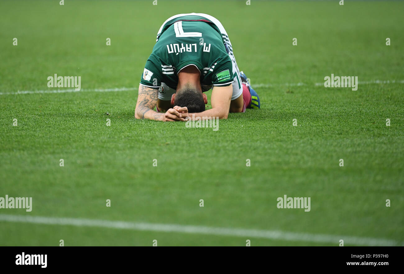 17 June 2018, Russia, Moscow, Soccer, FIFA World Cup, Group F, Matchday 1 of 3, Germany vs Mexico at the Luzhniki Stadium: Mexico's Miguel Layun kneels on the pitch. Photo: Ina Fassbender/dpa Stock Photo