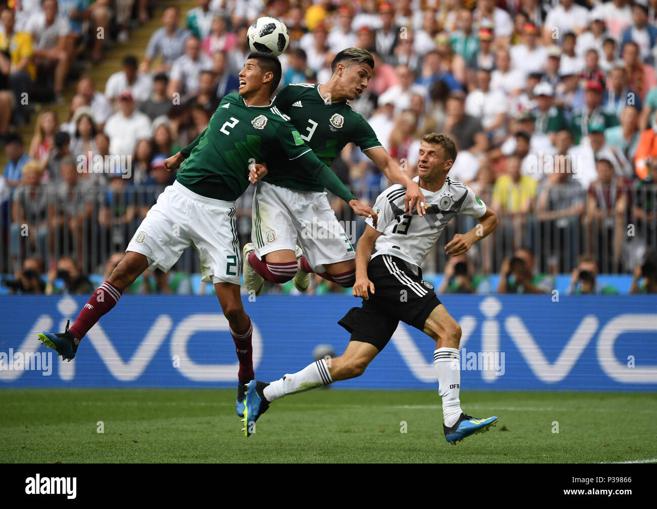 17 June 2018, Russia, Moscow, Soccer, FIFA World Cup, Group F, Matchday 1 of 3, Germany vs Mexico at the Luzhniki Stadium: Mexico's Hugo Ayala Castro (L-R) and Carlos Salcedo plays against Germany's Thomas Mueller. Photo: Ina Fassbender/dpa Stock Photo