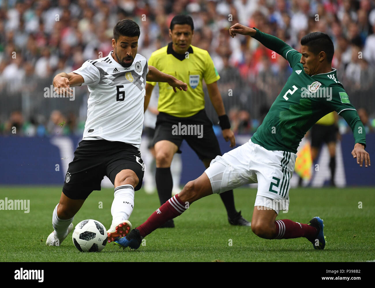 17 June 2018, Russia, Moscow, Soccer, FIFA World Cup, Group F, Matchday 1 of 3, Germany vs Mexico at the Luzhniki Stadium: Mexico's Hugo Ayala Castro and Germany's Sami Khedira (L) vie for the ball. Photo: Ina Fassbender/dpa Stock Photo