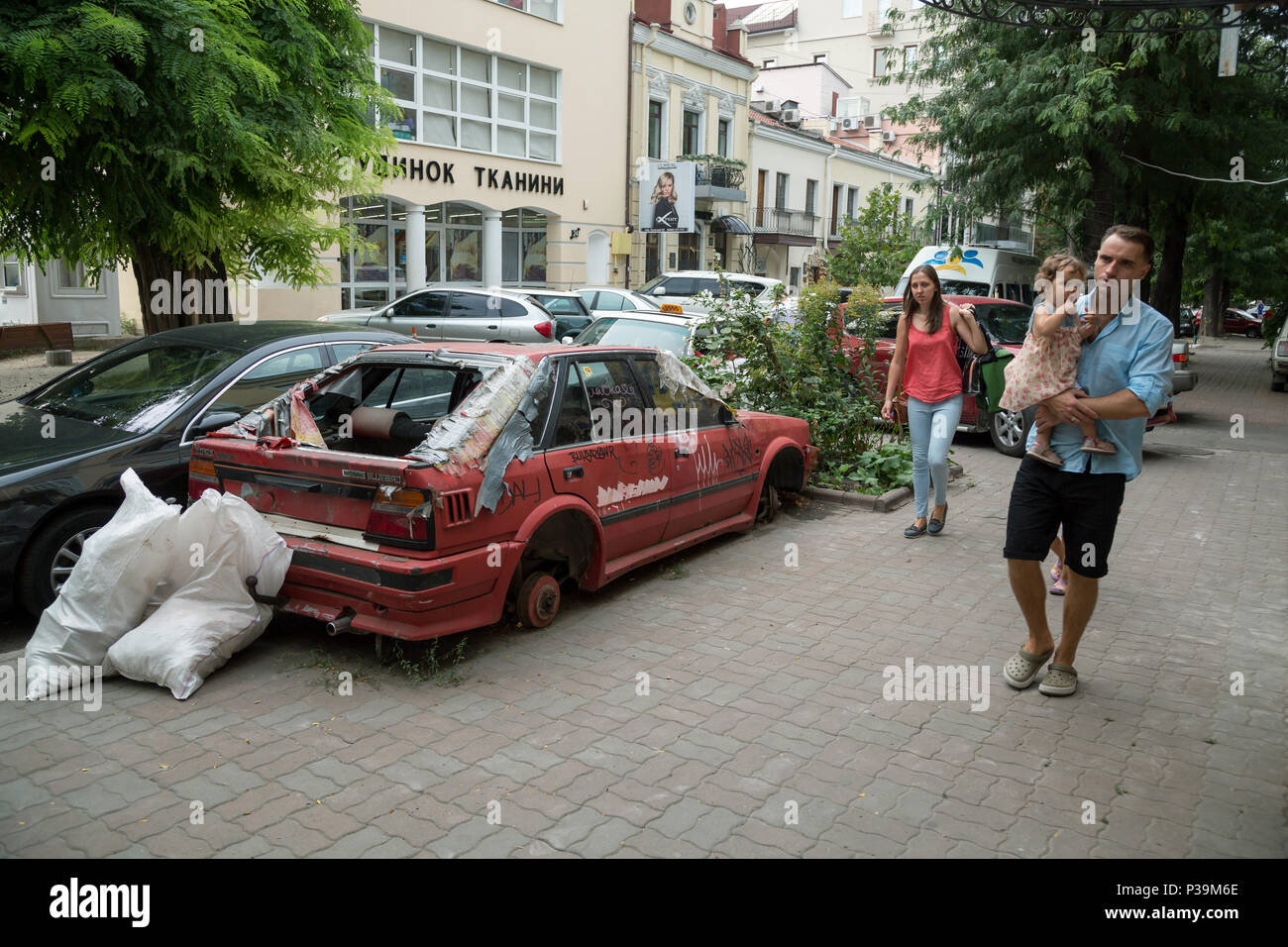 Odessa, Ukraine, carved-out wreckage of a car on the roadside Stock Photo