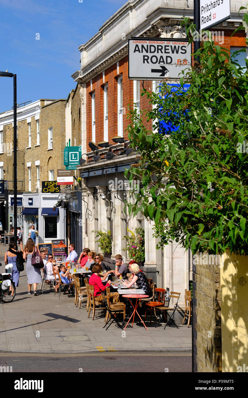 People enjoying warm summer day dining, Broadway Market, London, United Kingdom Stock Photo