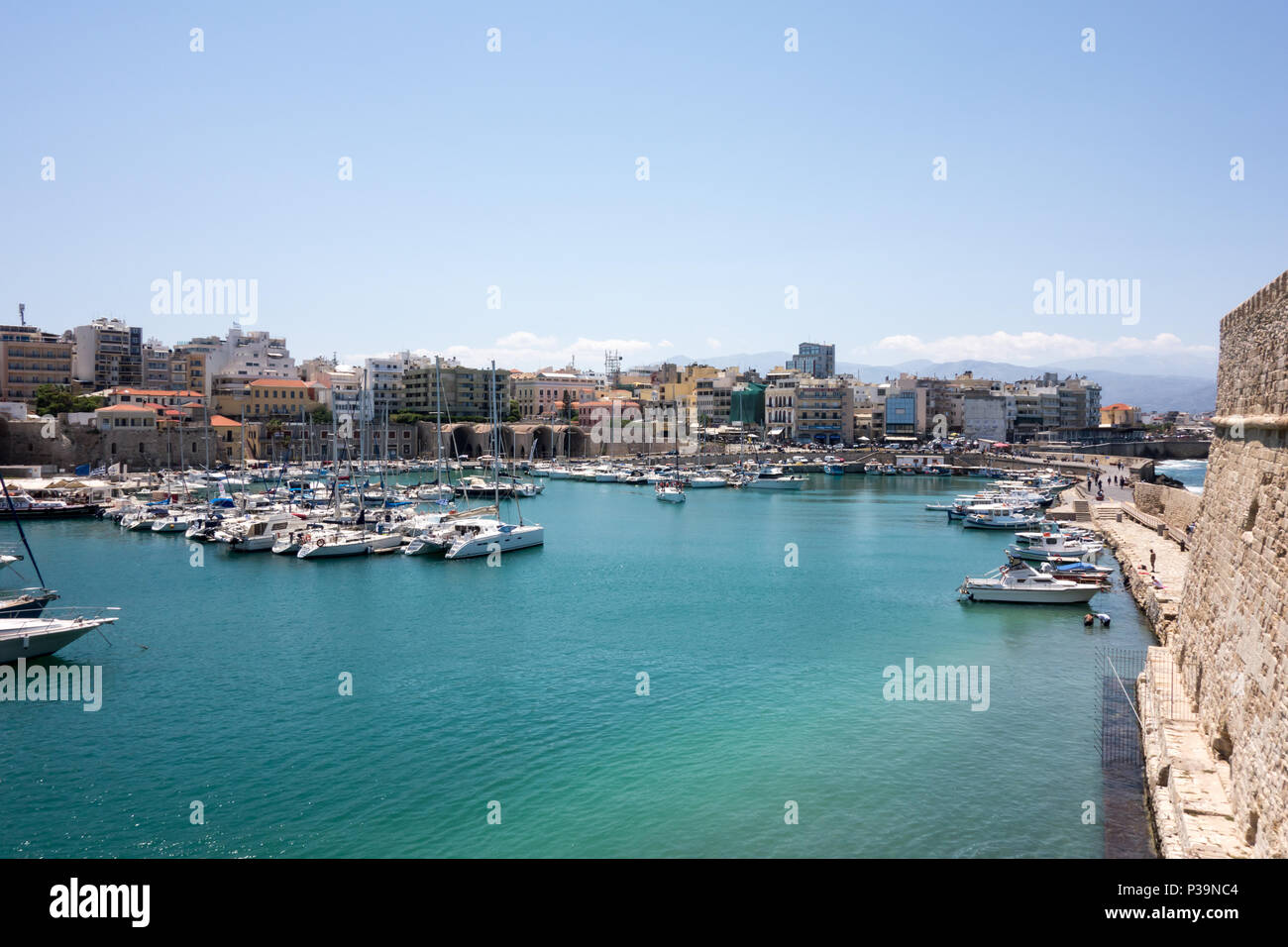 HERAKLION, CRETE - 13th May 2018: A view of the old Venetian harbour from the Koules Fortress. Stock Photo
