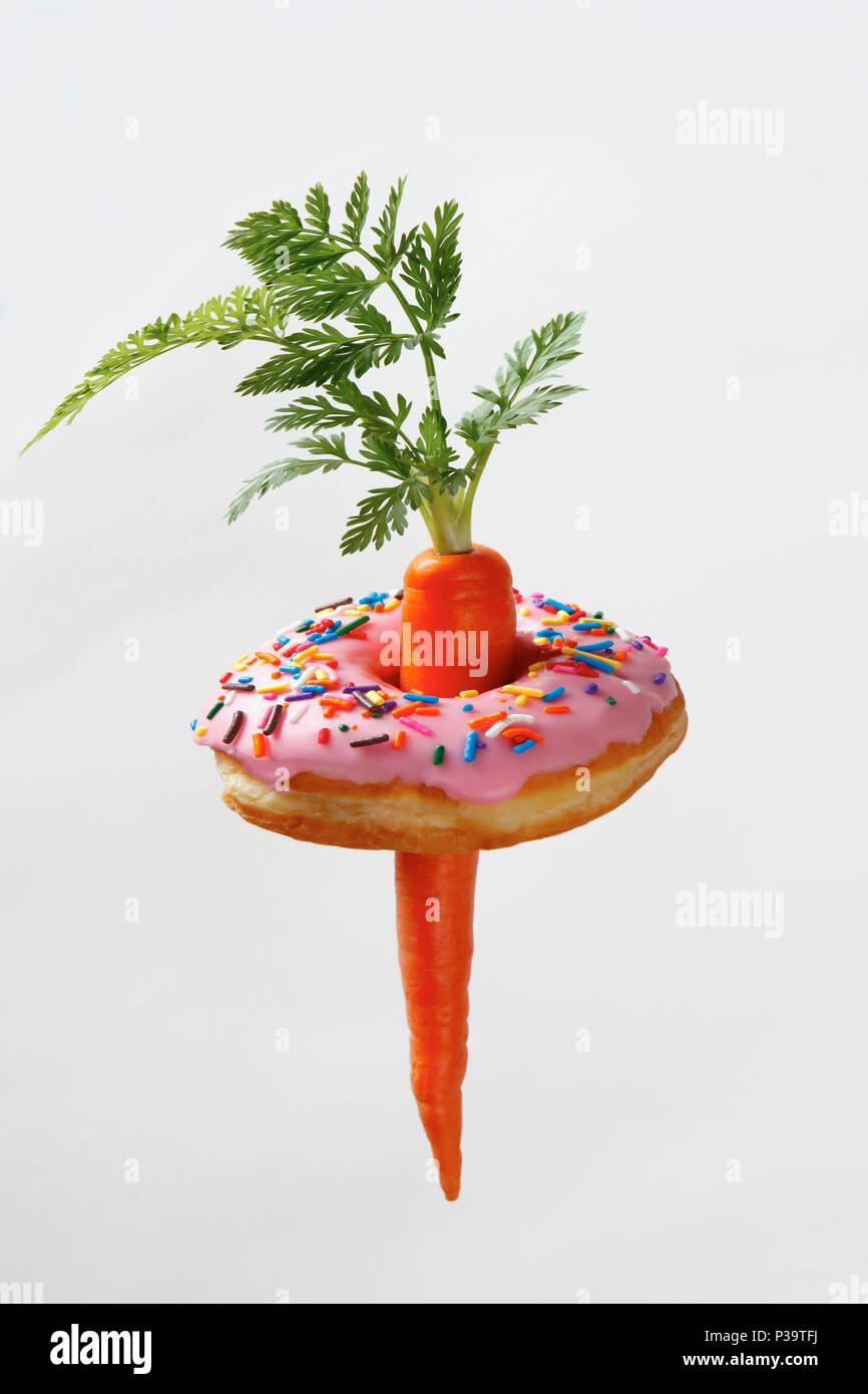 Carrot with sweet pink donut Stock Photo