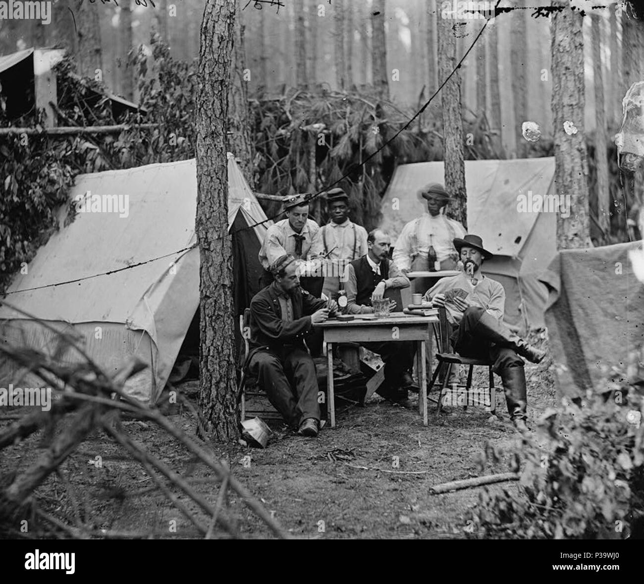 . [Petersburg, Va. Officers of the 114th Pennsylvania Infantry playing cards in front of tents]. Photographs of the main eastern theater of the war, the siege of Petersburg, June 1864-April 1865.. April 1864 3 Officers of the 114th Pennsylvania Infantry03882v Stock Photo
