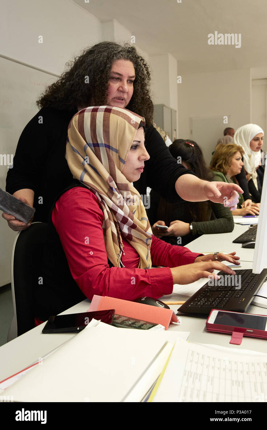 Berlin, Germany, refugee women learn how to use the computer Stock Photo