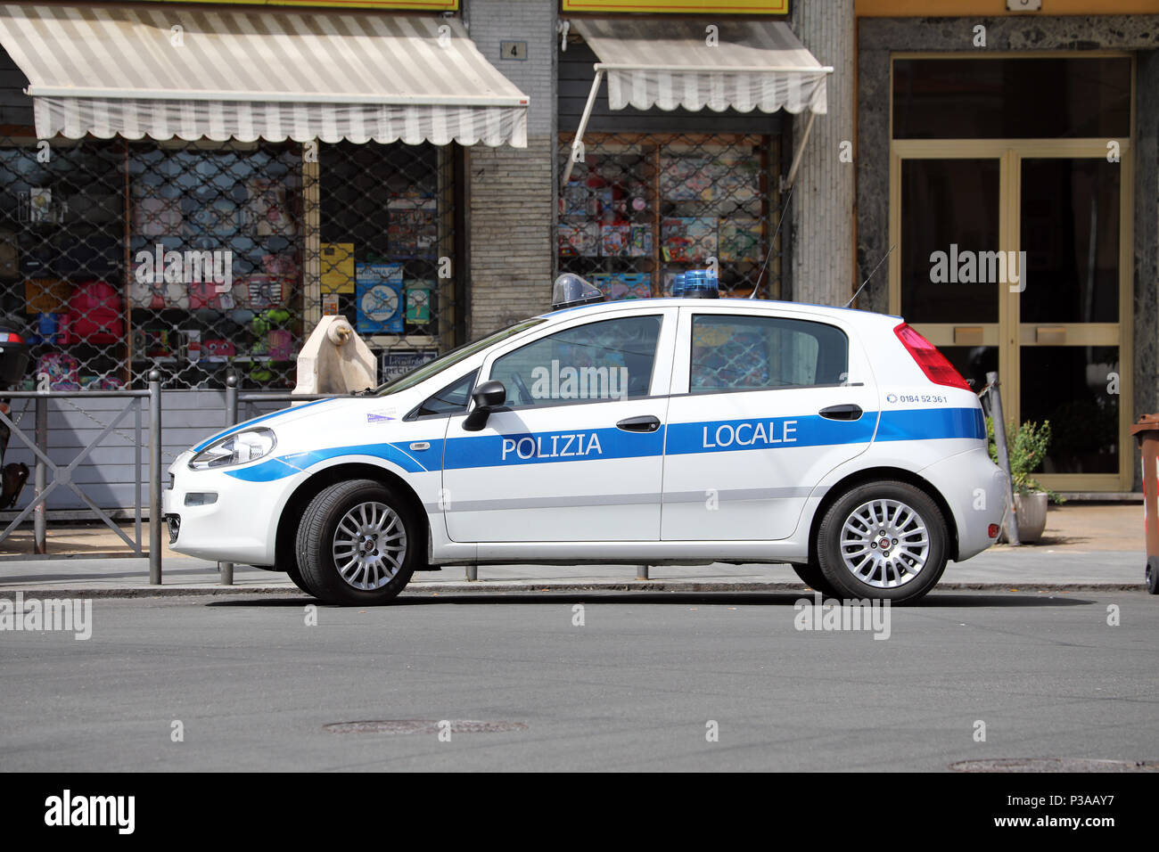San Remo, Italy - June 10, 2018: Fiat Punto III Hatchback Italian Police Car (Polizia Locale) Parked In The City Center of San Remo, Liguria, Italy Stock Photo