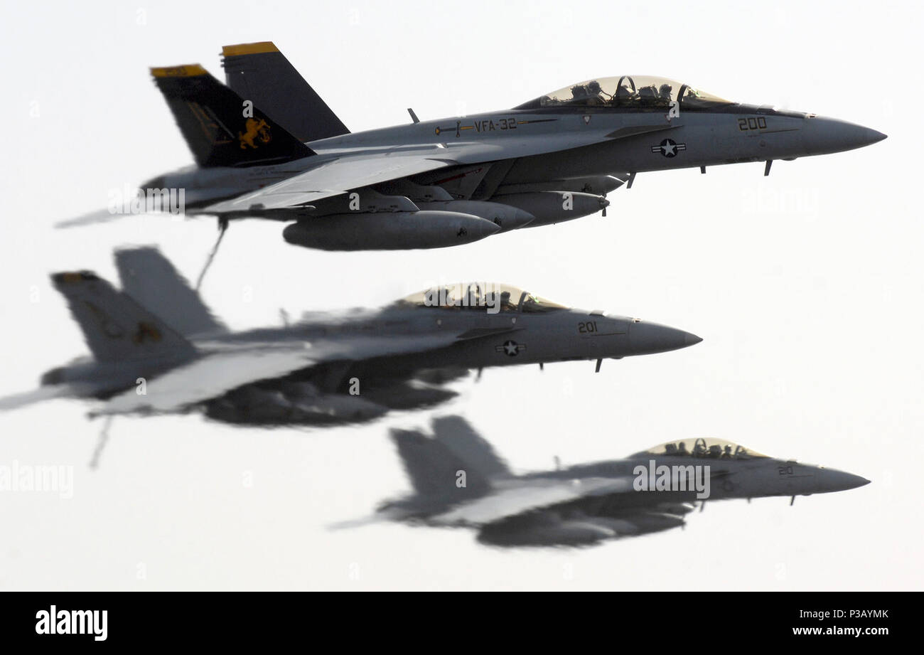 Three U.S. Navy F/A-18F Super Hornets aircraft assigned with Strike Fighter Squadron (VFA) 32 fly by the aircraft carrier USS Harry S. Truman (CVN 75) during flight operations in the Persian Gulf April 2, 2008. Truman is on a scheduled deployment in support of Operations Iraqi Freedom and Enduring Freedom. Stock Photo