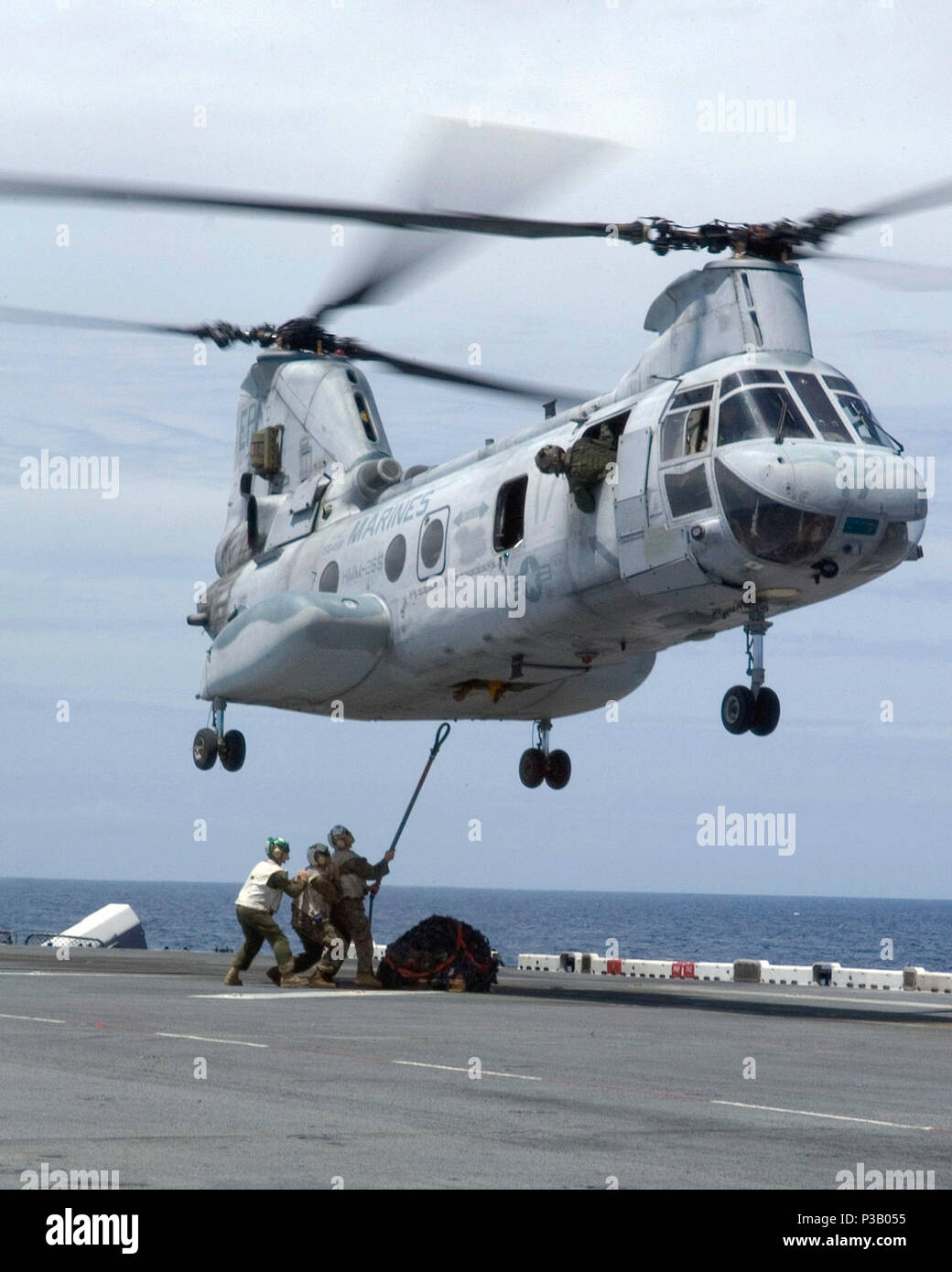 CHINA SEA (May 12, 2008) Cargo handlers aboard the USS Essex (LHD 2) conduct cargo hook training with a CH-46E Sea Knight assigned to Marine Medium Helicopter Squadron (HMM) 265. The Essex Expeditionary Strike Group is steaming to support a potential humanitarian assistance mission in the wake of Cyclone Nargis. U.S. Navy Stock Photo