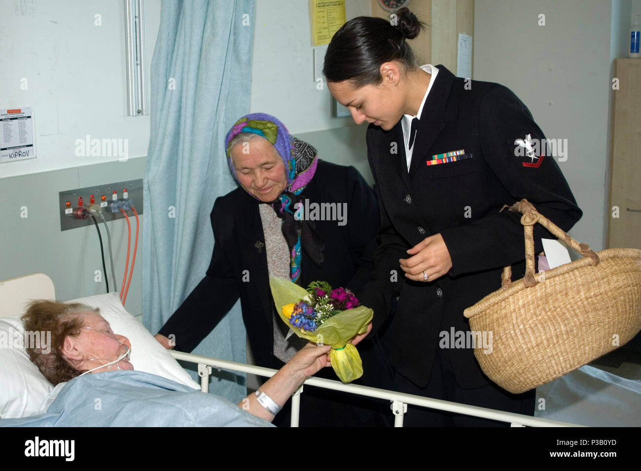 Australia (Sept. 2, 2008) Cryptologic Technician (Collections) 3rd Class Brittany Gonzales, from Corpus Christi, Texas, delivers a posy bunch to a Royal Melbourne Hospital patient during a community outreach project conducted by Sailors from the guided-missile destroyer USS John S. McCain (DDG 56). The ship's port visit to Melbourne is part of the Great White Fleet centennial anniversary celebration. U.S. Navy Stock Photo