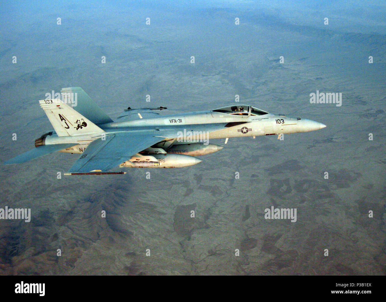 (Nov. 2, 2008) An F/A-18 Hornet from the 'Tomcatters' of Strike Fighter Squadron (VFA) 31 flies over Afghanistan during routine operations. VFA-31 is assigned to Carrier Air Wing (CVW) 8, deployed aboard USS Theodore Roosevelt (CVN 71). The Nimitz-class aircraft carrier is on a scheduled deployment in the 5th Fleet area of responsibility and is focused on reassuring regional partners of the United States' commitment to security, which promotes stability and global prosperity. Stock Photo