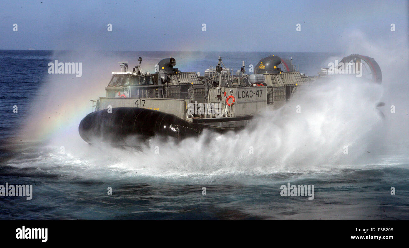 081110-M-5222L-008  Camp Pendleton, Calif. (Nov. 10, 2008) A Landing Craft Air Cushion accelerates after exiting out of the fan tail of the amphibious assault ship USS Boxer (LHD 4), making a routine run from the ship to shore during the 13th Marine Expeditionary Unit's Expeditionary Strike Group Integration exercise off the coast of Camp Pendleton. Stock Photo