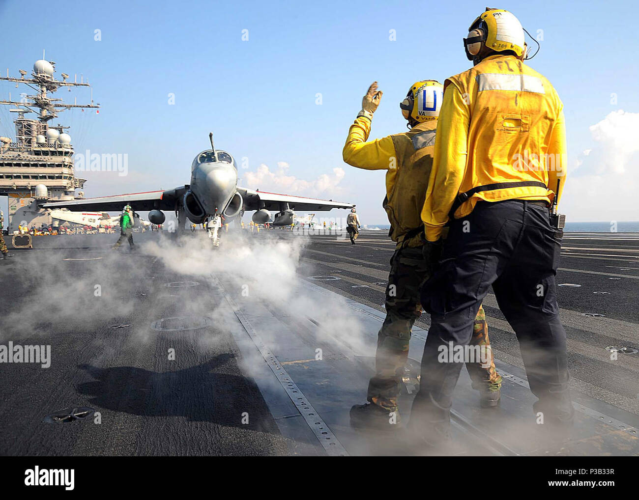 OF OMAN (Dec. 17, 2008) Cmdr. Michael D. McKenna, prepares to launch EA-6B Prowler assigned to the 'Shadowhawks' of Electronic Attack Squadron (VAQ) 141 from the flight deck of the aircraft carrier USS Theodore Roosevelt (CVN 71) before an in-air change of command ceremony. Theodore Roosevelt and Carrier Air Wing (CVW) 8 are conducting operations in the U.S. 5th Fleet area of responsibility and are focused on reassuring regional partners of the United States' commitment to security, which promotes stability and global prosperity. Stock Photo