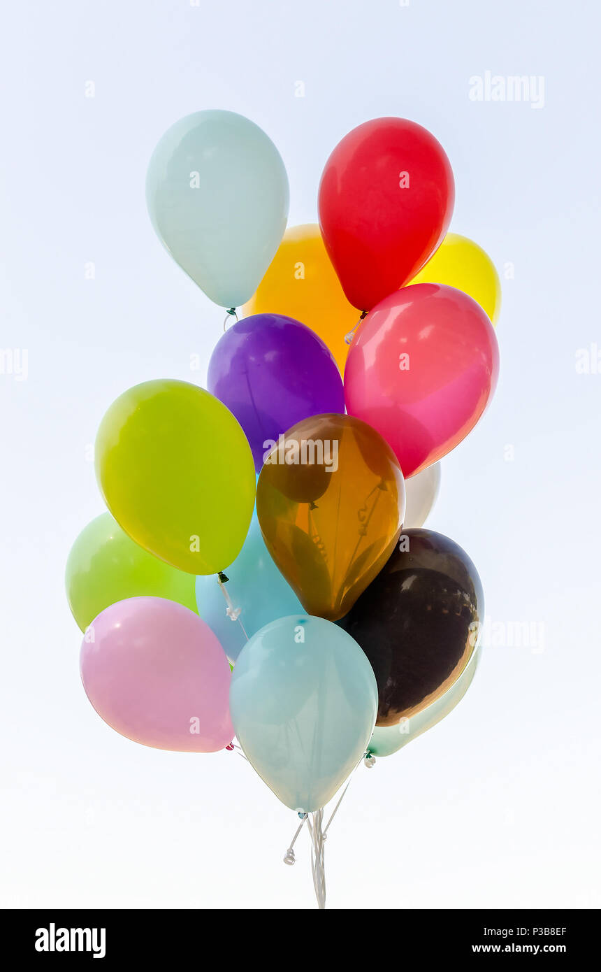 Colorful bunch of helium balloons isolated on background Stock Photo ...