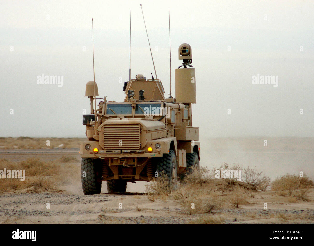 PROVINCE, Afghanistan (Dec. 8, 2009) Members of the Naval Mobile Construction Battalion (NMCB) 74 convoy security element use mine-resistant ambush-protected (MRAP) vehicles to set perimeter security for a route development project. NMCB-74 has been charged with improving key convoy routes in Helmand Province, Afghanistan. Stock Photo