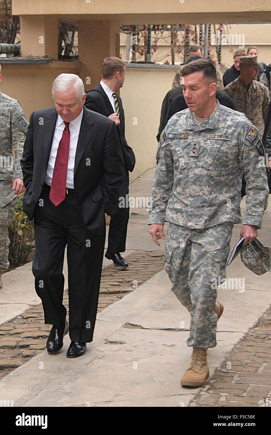 EGGERS, Afghanistan – United States Secretary of Defense Robert Gates, left, talks with U.S. Army Lt. Gen. William Caldwell IV, right, Commander of NATO Training Mission – Afghanistan as they walk during Gates' visit to Camp Eggers Dec. 8, 2009. Camp Eggers is the headquarters for the newly established command, NATO Training Mission - Afghanistan and Combined Security Transition Command - Afghanistan. Stock Photo