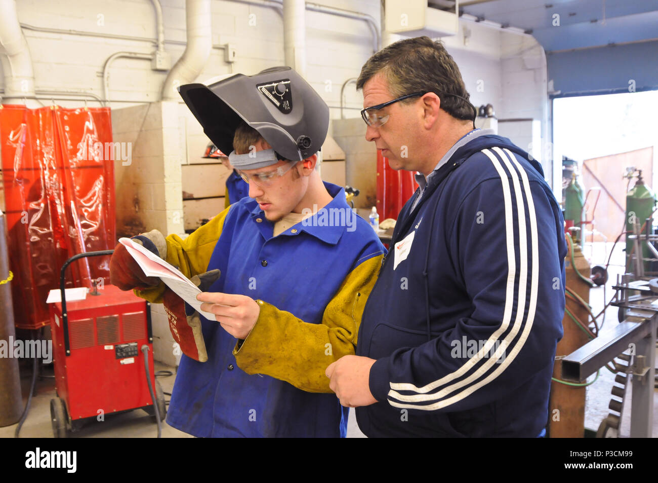 Welding student and instructor Stock Photo Alamy