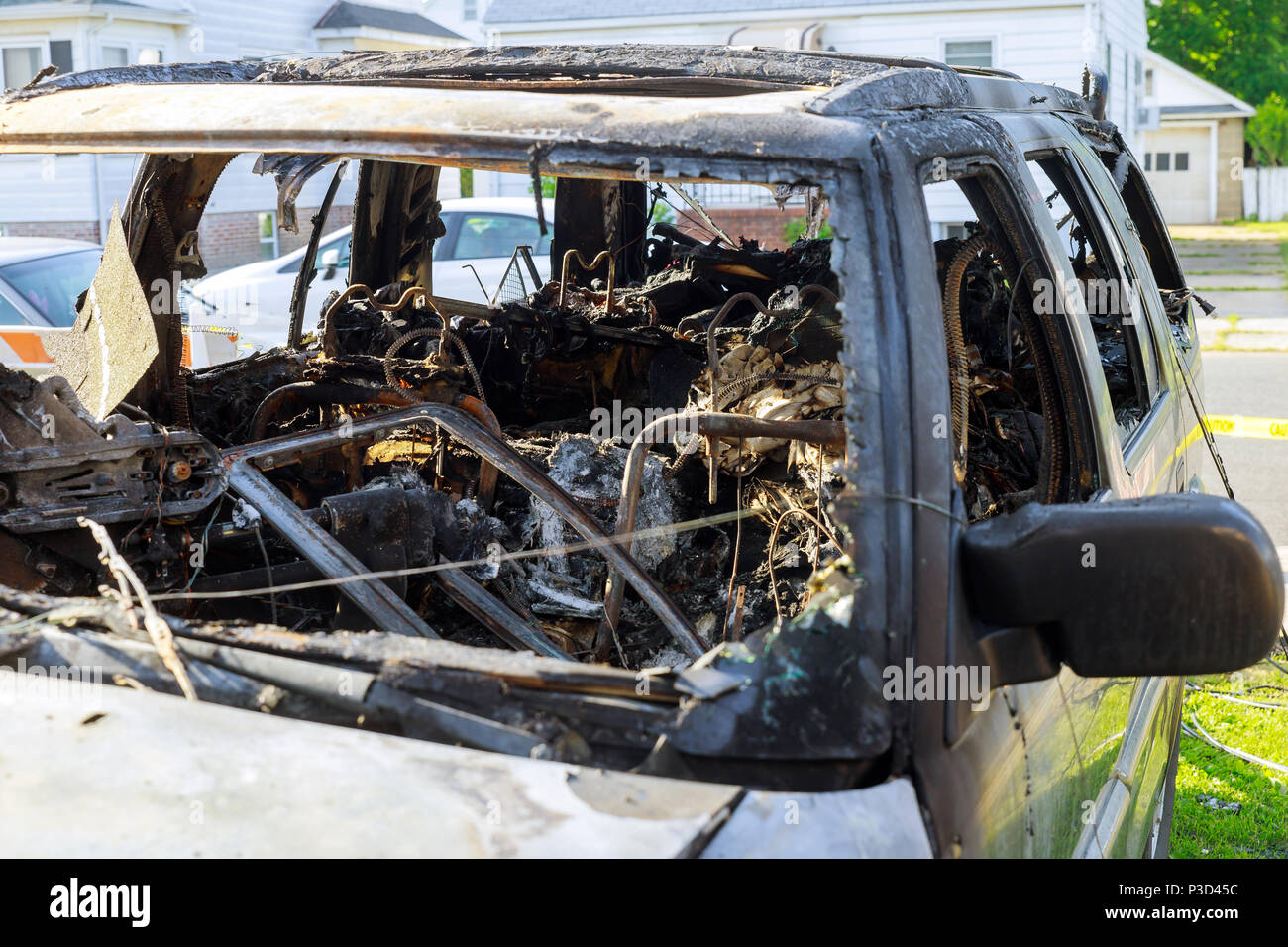The front wing of the car and the wheel without a tire after the fire. Burned car Stock Photo