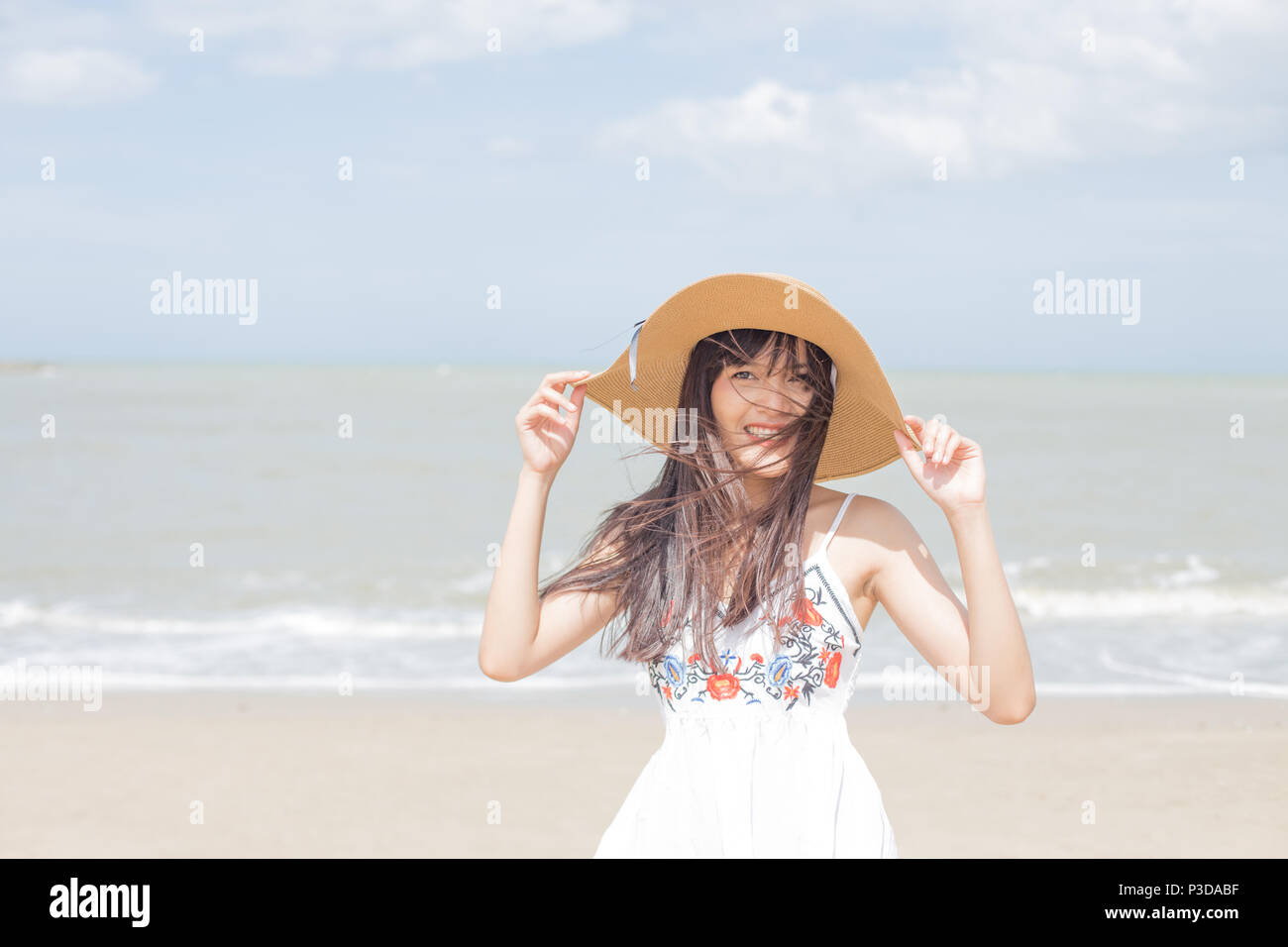 Thai girl enjoy and happy her relaxing on the beach, Hua Hin, Thailand Stock Photo
