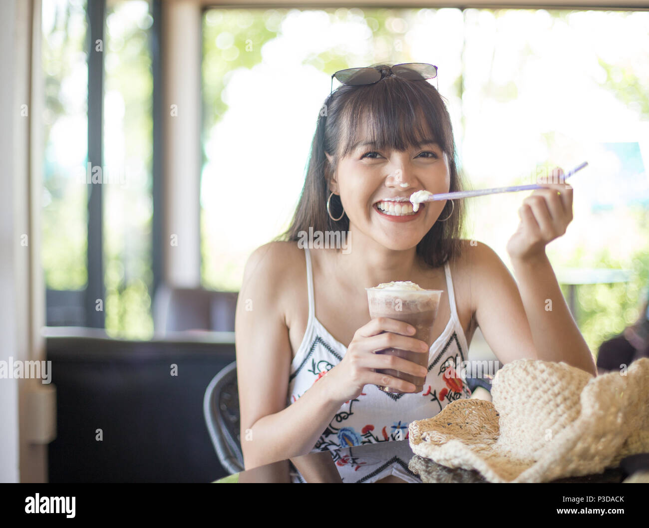 Young girl smile enjoy and happy drinking cold drink Stock Photo