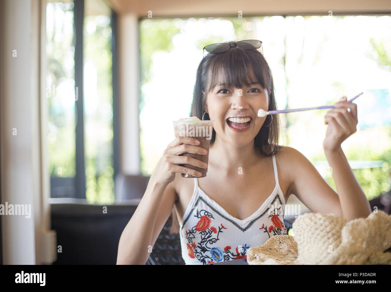 Young girl smile enjoy and happy drinking cold drink Stock Photo