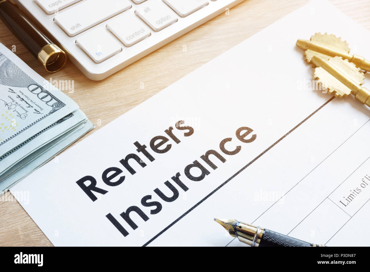 Renters Insurance form on a table and keys. Stock Photo