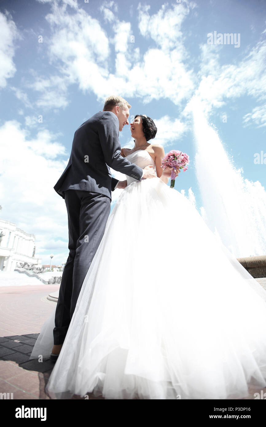 happy bride and groom on the background of the city Stock Photo - Alamy