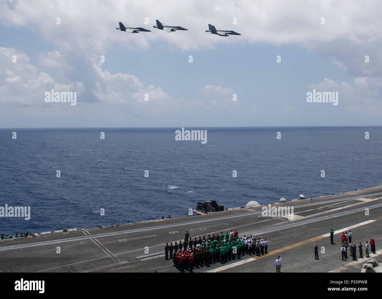180616-N-UJ486-0386 MEDITERRANEAN SEA (June 16, 2018) F/A-18 Super Hornets perform a fly-by during a change of command ceremony for Strike Fighter Squadron (VFA) 81 aboard USS Harry S. Truman (CVN 75) June 16, 2018. Harry. S. Truman is currently deployed as part of an ongoing rotation of U.S. forces supporting maritime security operations in international waters around the globe. (U.S. Navy photo by Mass Communication Specialist 2nd Class Rebekah A. Watkins/Released) Stock Photo