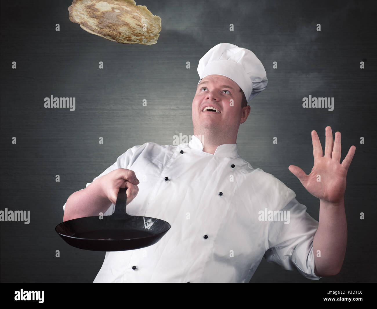Chef fries fresh pancakes Stock Photo
