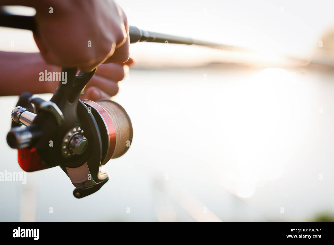 Fishing gear - fishing spinning, fishing line and sports equipment Stock  Photo - Alamy