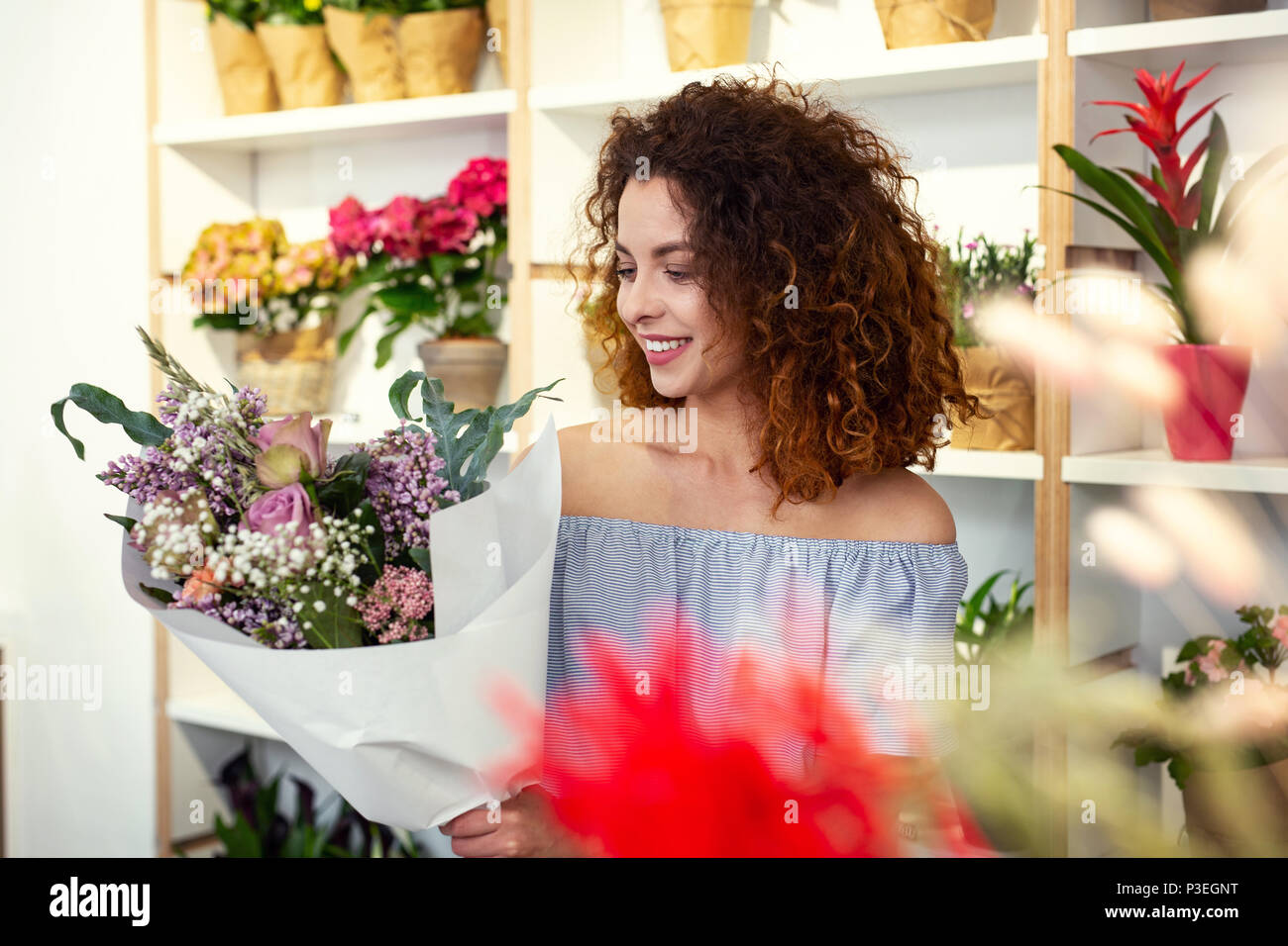 Woman admiring beauty flower hi-res stock photography and images - Alamy