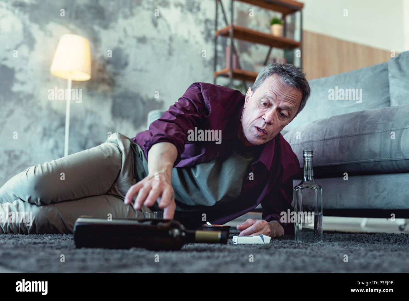 Alcohol addicted man throwing bottle away Stock Photo Alamy