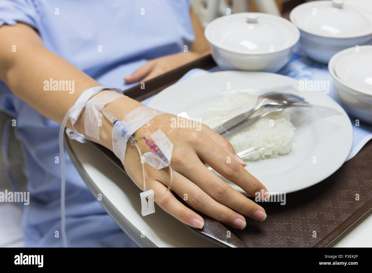 Asian Pregnant Woman patient is on drip receiving a saline solution