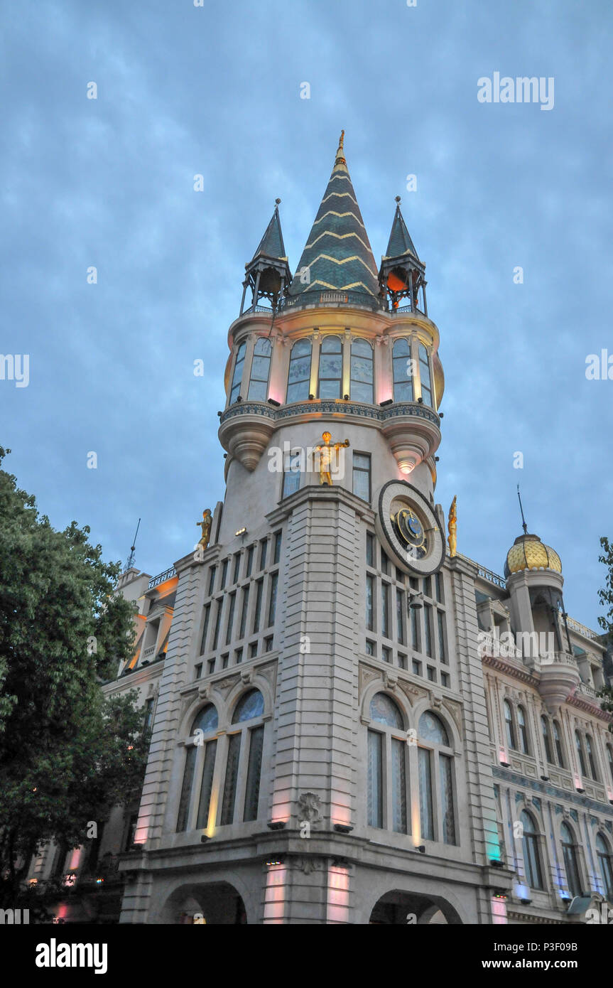 Astronomical clock tower, on the restored facade of the former National Bank building in Europe park, Batumi, Georgia Photographed at night Stock Photo