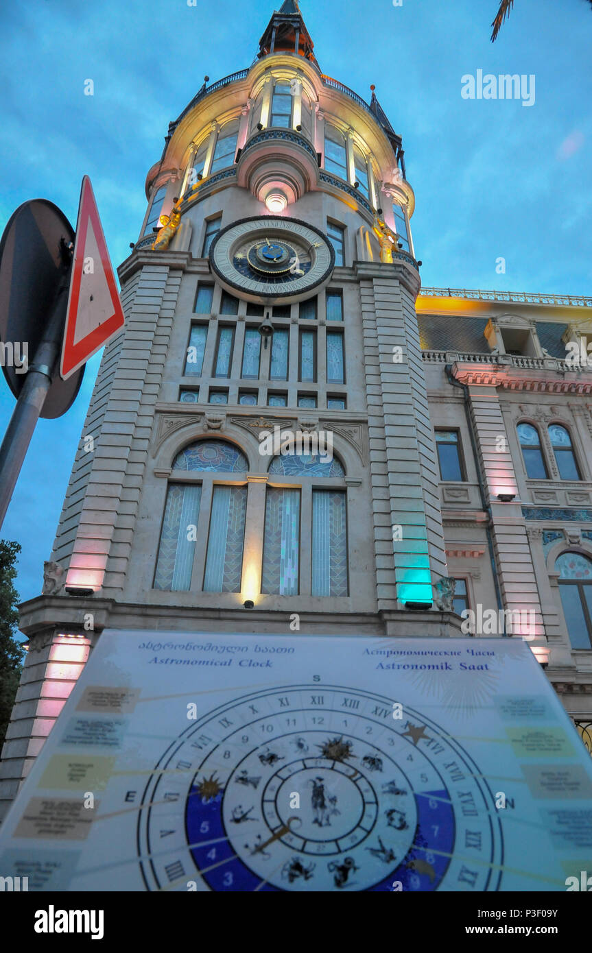 Astronomical clock tower, on the restored facade of the former National Bank building in Europe park, Batumi, Georgia Photographed at night Stock Photo
