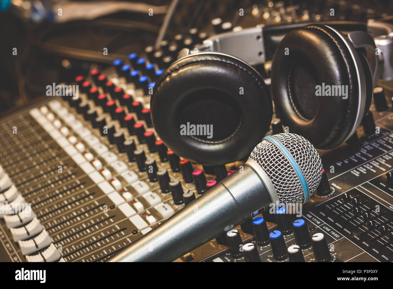 Close up instruments music background concept.Single microphone with  headphones on sound mixer board in home recording studio.Free space for  creative Stock Photo - Alamy