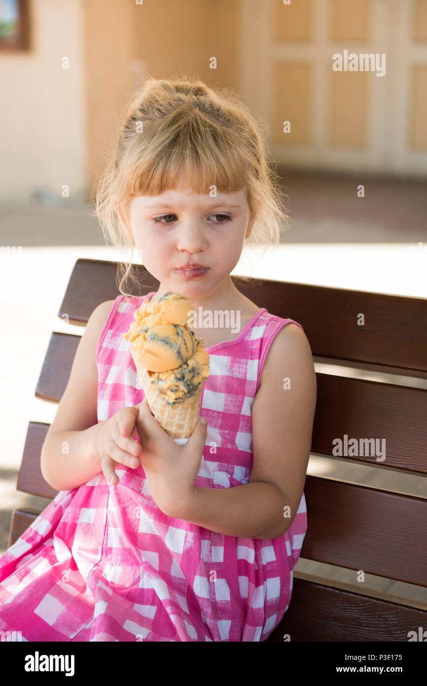 Girl having ice cream on a sunny day Stock Photo