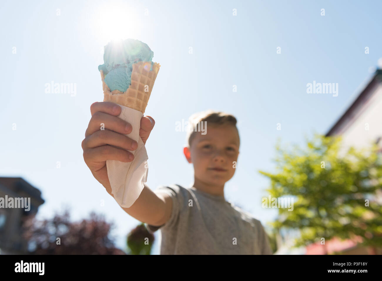 Boy holding double scooped ice cream Stock Photo