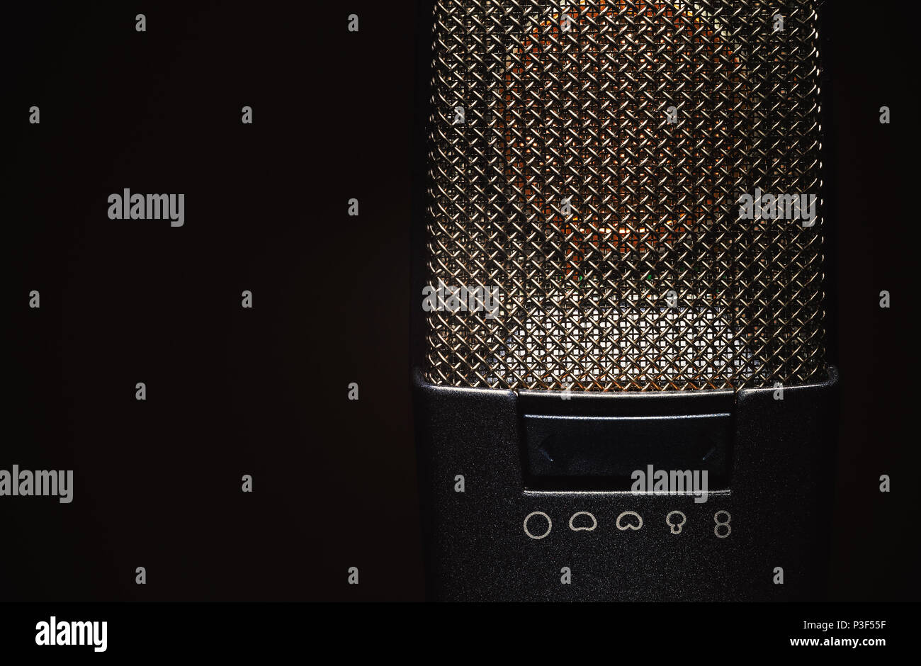 Closeup view on modern condenser microphone, membrane and pattern details. Stock Photo