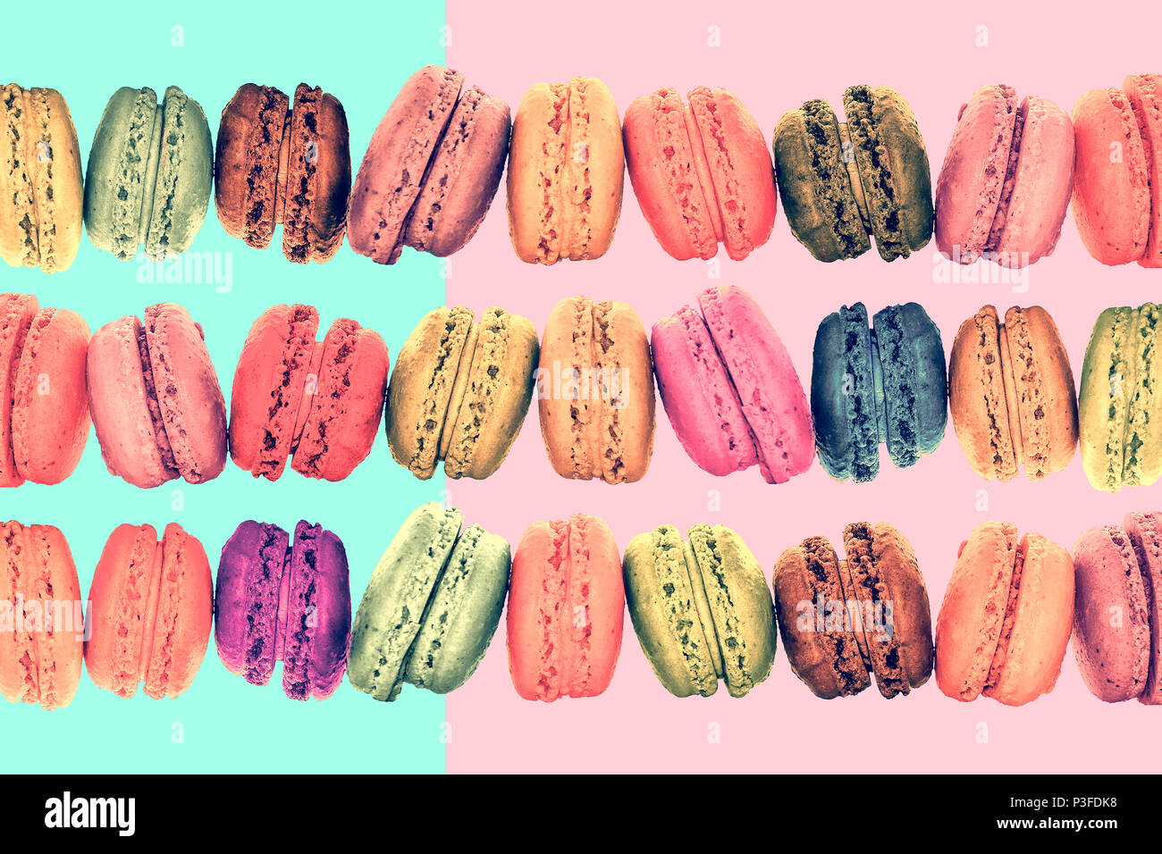 Colorful rows macarons on vintage pastel  background Stock Photo