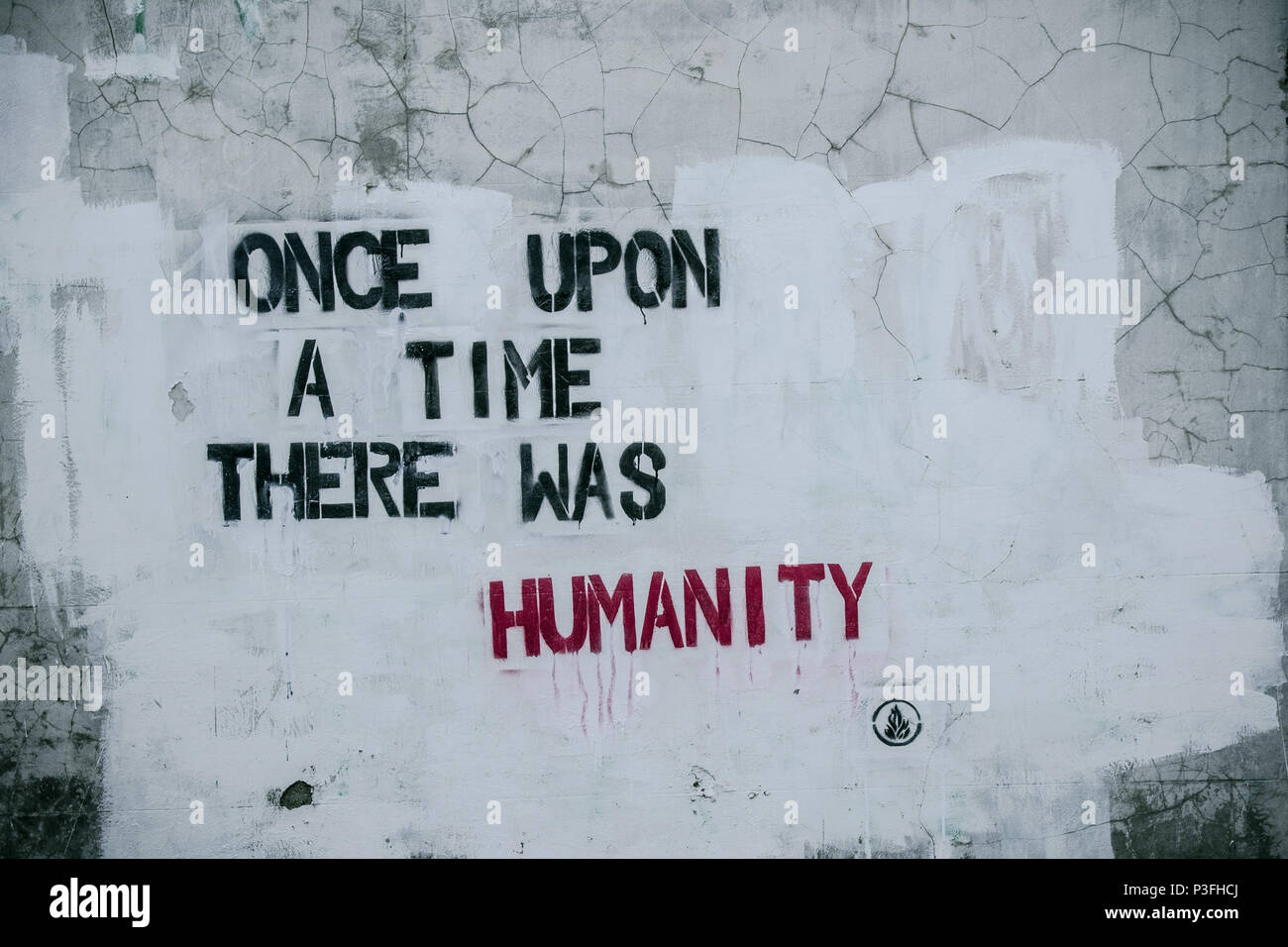 Message on the wall. Once upon a time there was humanity. Stock Photo