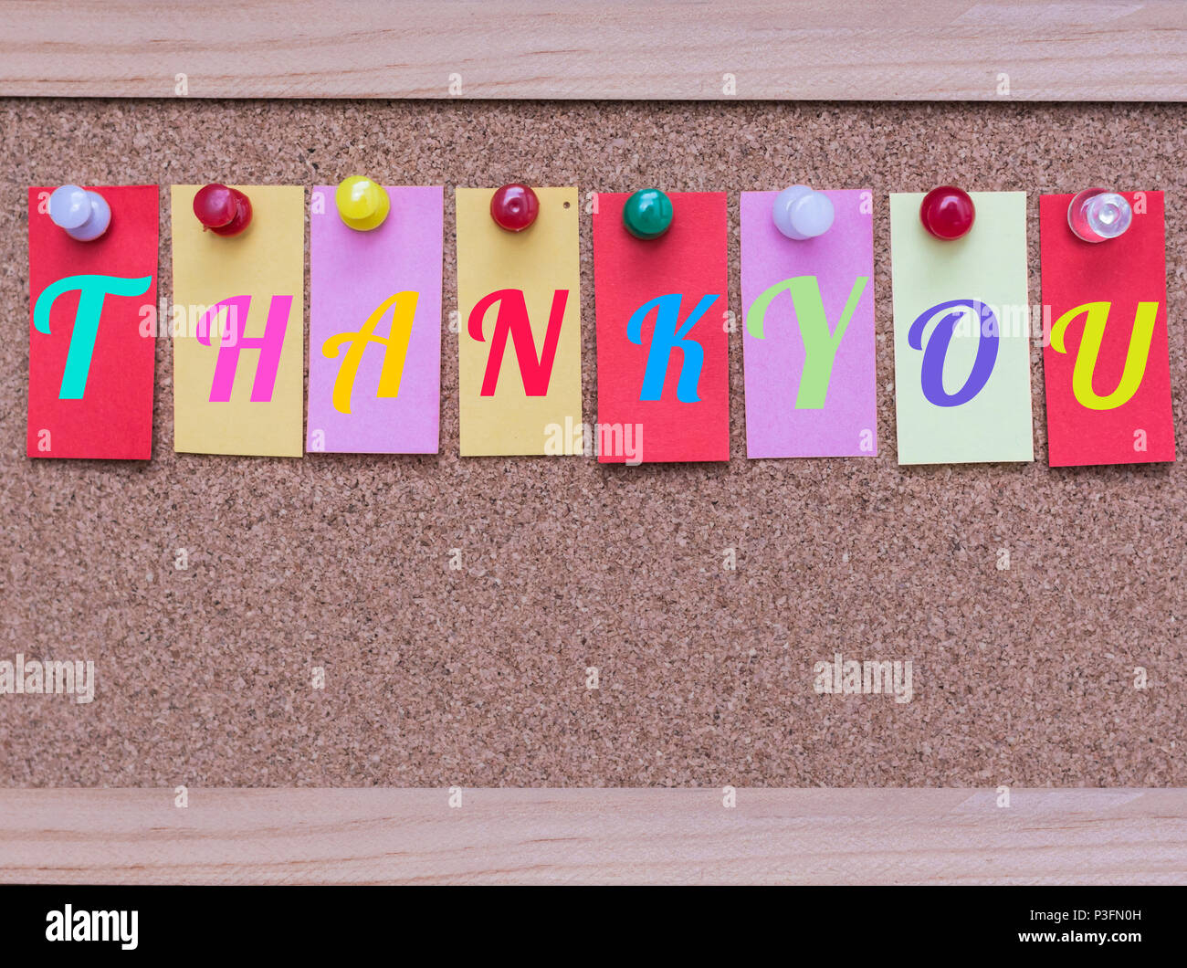 Colored Sticky Notes with White Words Thank You Pinned to a Cork ...