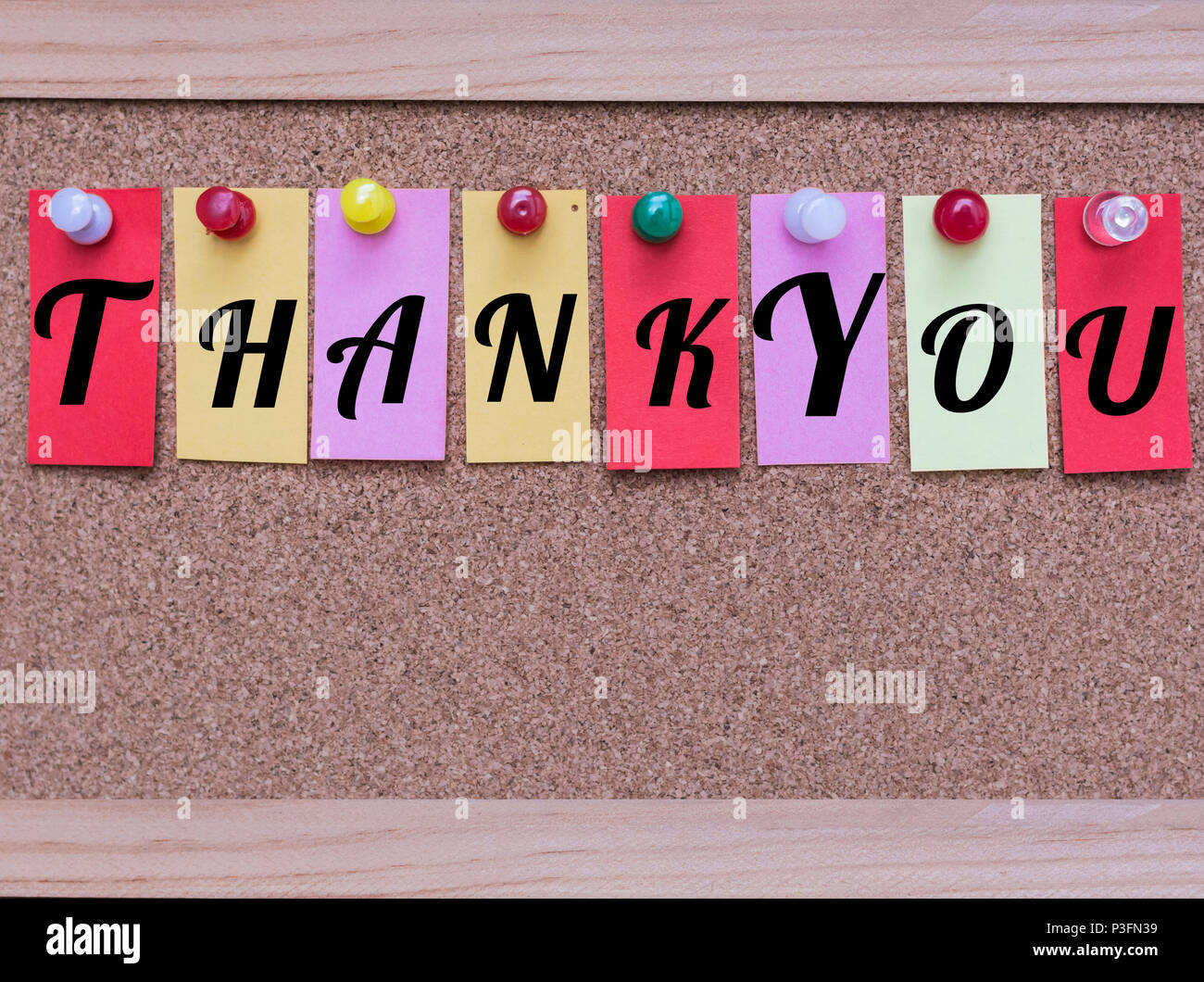 Colored Sticky Notes with White Words Thank You Pinned to a Cork ...