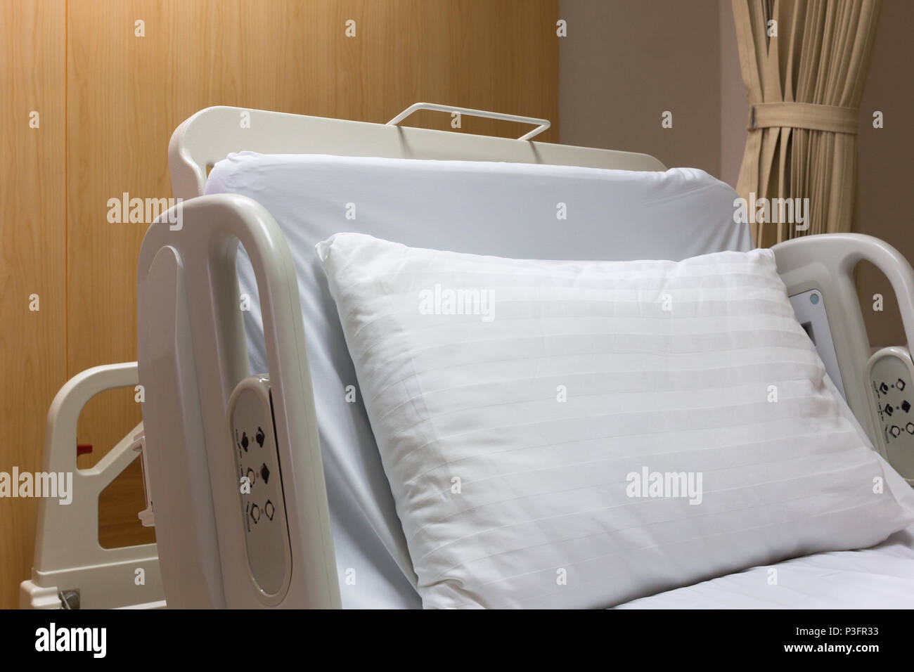 Modern and comfortable equipped empty bed in luxury room at hospital