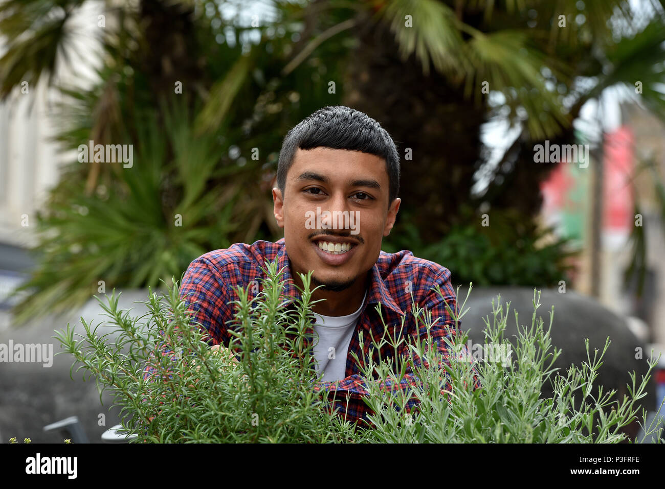 Pictures show Ibby Tarafdar, aged 27 years of Gabalfa, Cardiff. Ibby a graphic designer has been commissioned by Jay Z , but still works at Starbucks Stock Photo